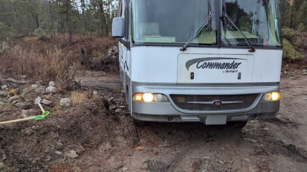 photo of a 35' motorhome after finally clearing a mud bog