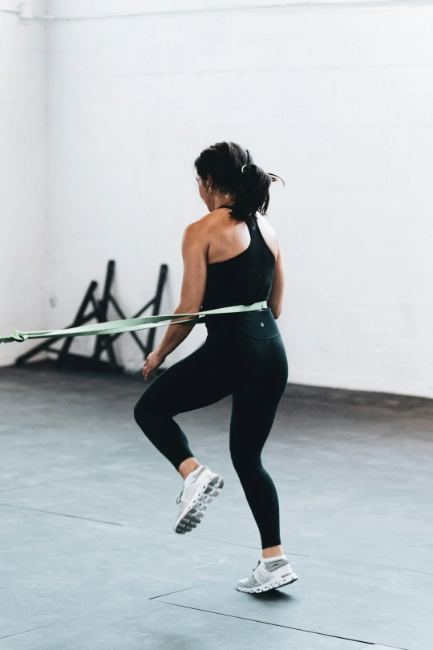 image of a person using resistance bands for training