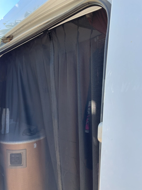 image of a bug screen for sprinter van from the outside looking in